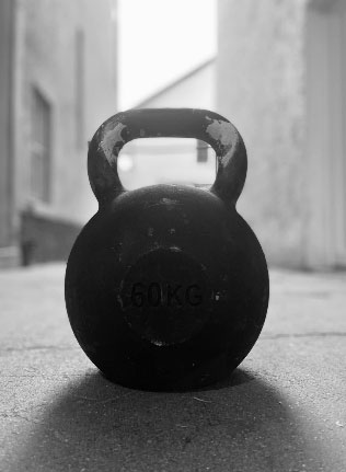 Kettlebell 60 kg on the pavement  in an ally